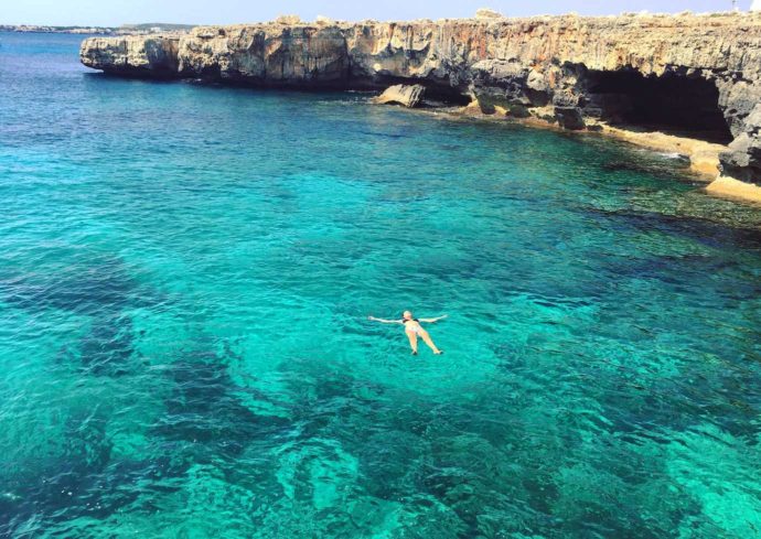 Cala Blanca, floating in a cove, Menorca
