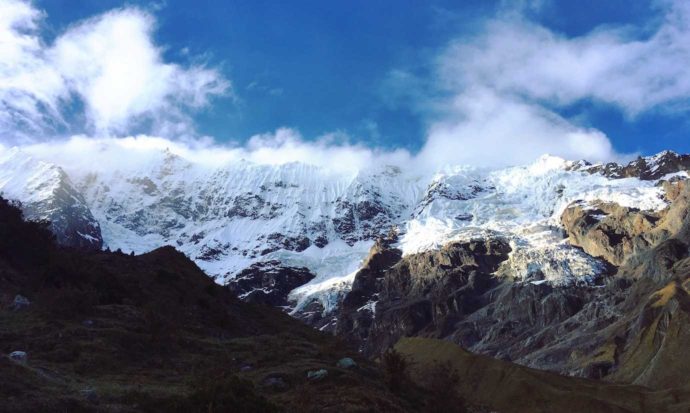 Salkantay trek day 1. Walking up to Humantay Lake surrounded by snowcapped mountains