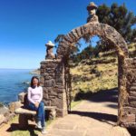 overview of lake Titicaca. me sat by an arch on taquile island