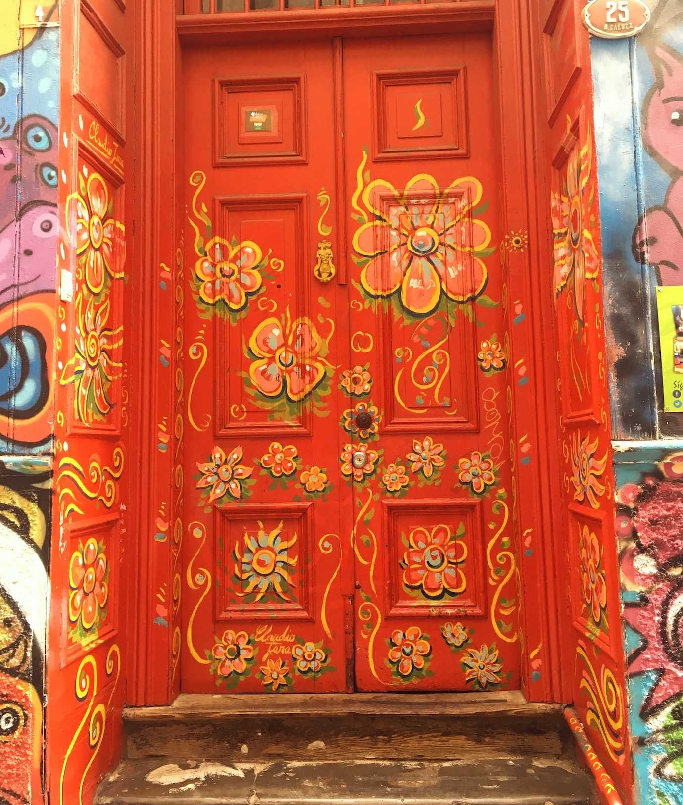 red flowered door street art valparaiso