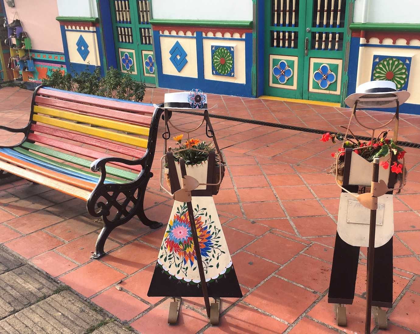 colourful bench and mini people art guatape