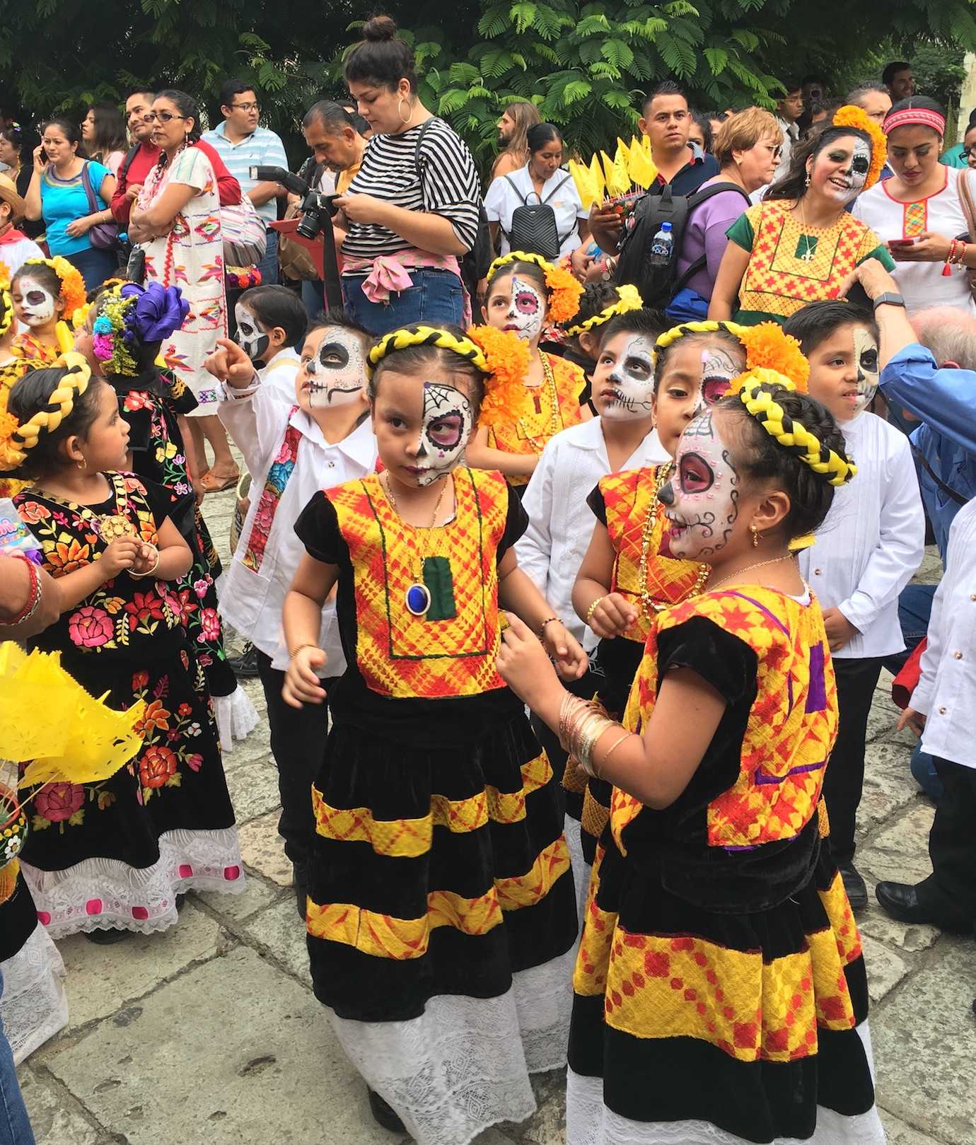 little girls at day of dead parades Oaxaca