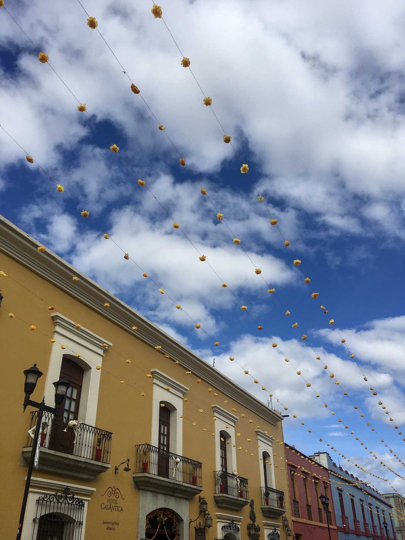 yellow building blue sky oaxaca